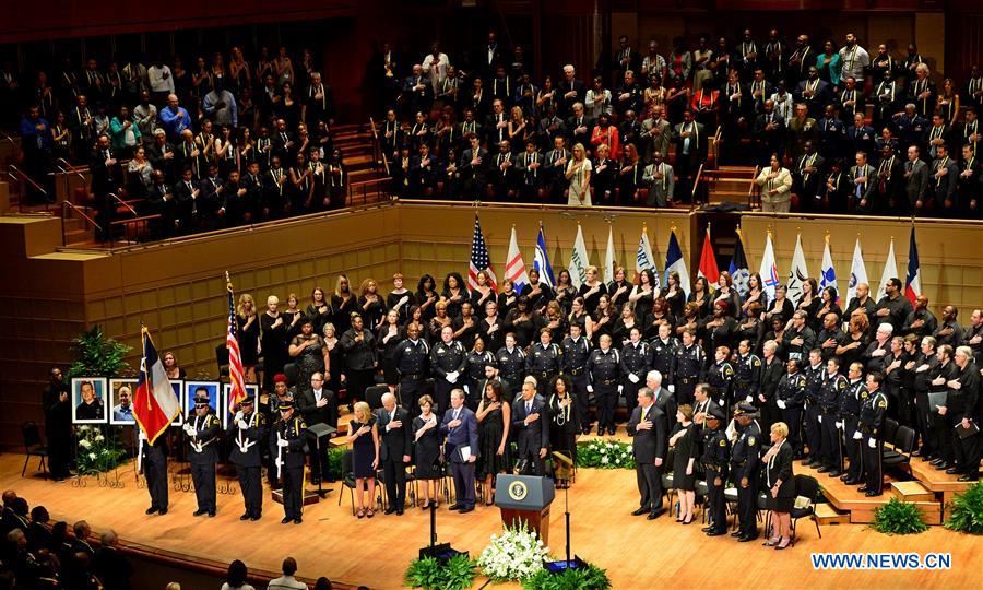 U.S. President Barack Obama (R) speaks during a memorial service to honor five police officers in Dallas, Texas, July 12, 2016. 