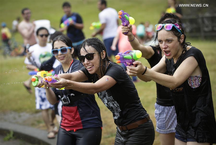 People with water guns participate in Vancouver Water Fight event at Stanley Park in Vancouver, Canada, on Aug. 6, 2016.