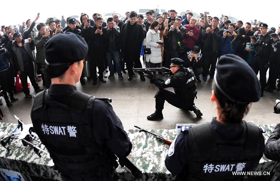 A SWAT member shows his skills during an open day event held by local railroad police at Wuhan Railway Station, central China's Hubei Province, Jan. 4, 2017.