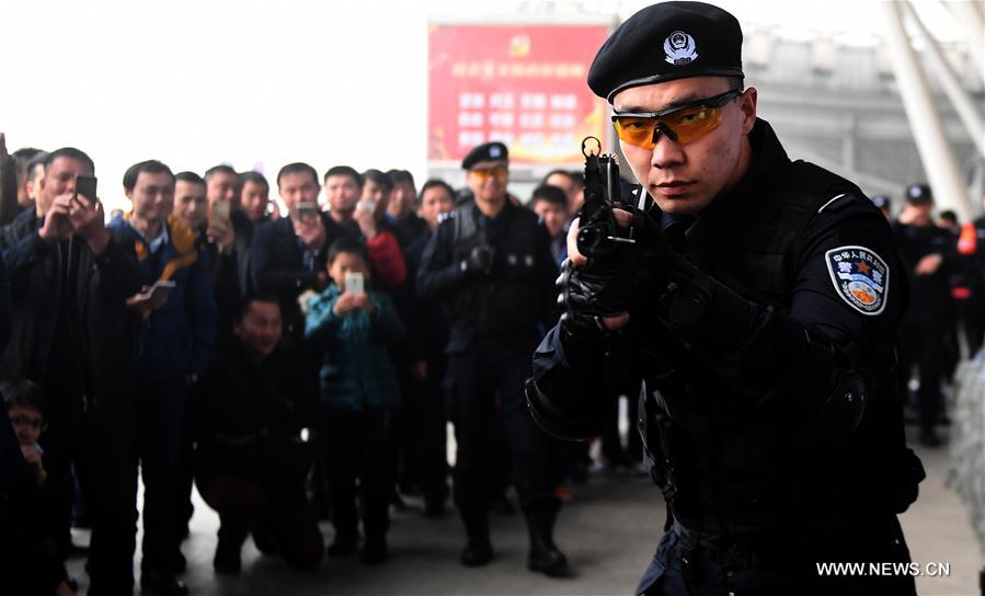 A SWAT member shows his skills during an open day event held by local railroad police at Wuhan Railway Station, central China's Hubei Province, Jan. 4, 2017.