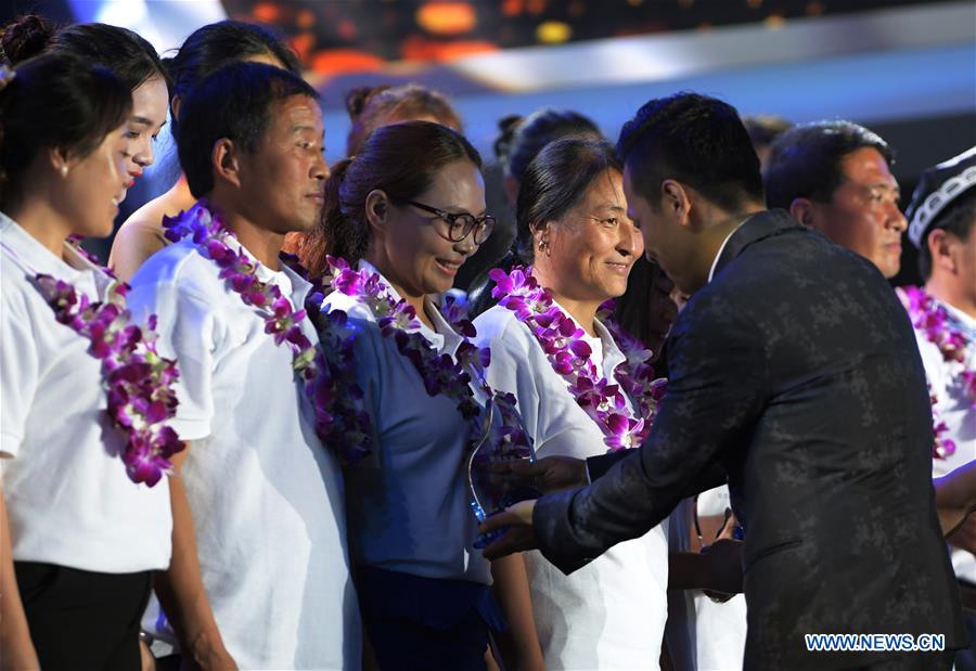 Winners of the Jack Ma Rural Teachers Award receive their awards during the awarding ceremony in Sanya, a tourism resort in south China's Hainan Province, on Jan. 5, 2017. The awarding ceremony of the Jack Ma Rural Teachers Award was held on Thursday, with 100 rural teachers winning the award of 100,000 yuan (14,522 U.S. dollars) respectively. (Xinhua/Yang Guanyu) 