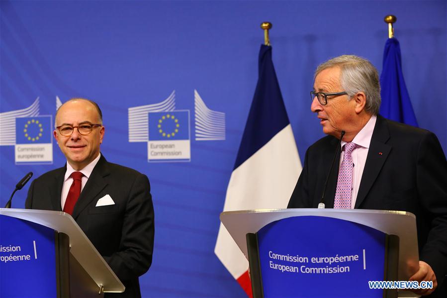 EU-BRUSSELS-CAZENEUVE-JUNCKER