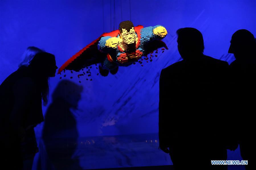 Visitors look at the work 'Soaring' made of Lego bricks during the exhibition 'The Art of Brick: DC Super Heroes' by artist Nathan Sawaya, on the South Bank in London, Britain, on Feb. 28, 2017. The exhibition featured sculptures based on the DC Comics universe and used more than 2 million Lego bricks. 