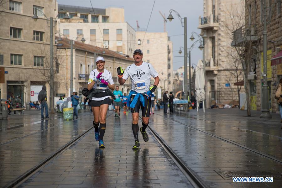 Runners take part in the 7th International Jerusalem Winner Marathon in Jerusalem, on March 17, 2017. (Xinhua/Guo Yu)