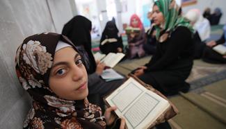 Palestinian children read holy Quran at mosque during Ramadan