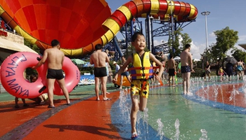 Children enjoy themselves at Maya Water Park in Shanghai