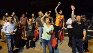 Protesters defy curfew, take to streets of Turkish cities