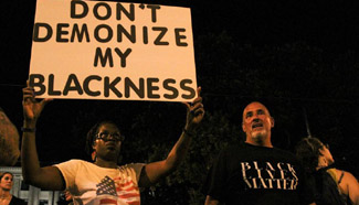 Demonstrators protest against fatal shooting of black man in Charlotte