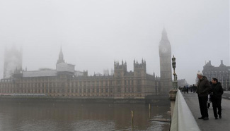 Fog shrouds central London, Britain