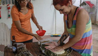 People make traditional Venezuelan dishes for New Year's dinner