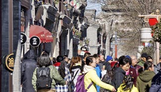 Tourists visit Qianmen Street in Beijing
