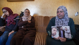Palestinian mother mourns her son in West Bank village of Al-Walajah