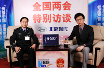 全國人大代表梁志毅做客新華網、中國政府網設在大會堂的訪談間