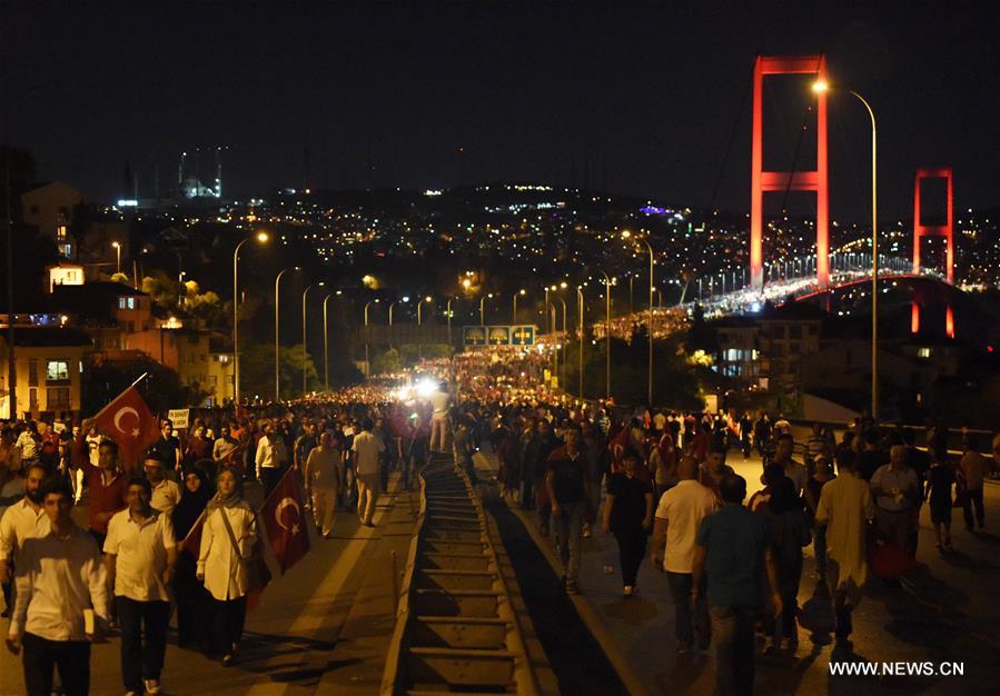 Thousands of Turks gathered on Thursday night on the bridge in Istanbul to denounce a failed coup attempt that killed at least 242 people and wounded 1,440 others last week