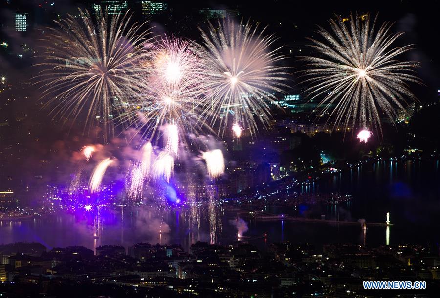 Fireworks illuminate sky over Leman Lake during Geneva Festival in
