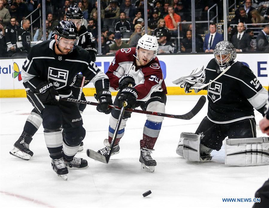 Jonathan Quick #32 and Alec Martinez #27 of the Los Angeles Kings celebrate  their win against the Colorado Ava…