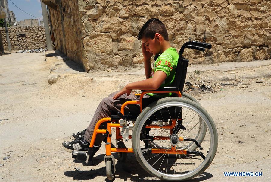 SYRIA-ALEPPO-SYRIAN BOY-PARALYSIS LEFT BY WAR