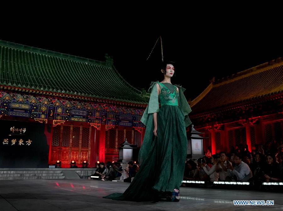 Beijing, China. 16th May, 2018. Models present creations designed