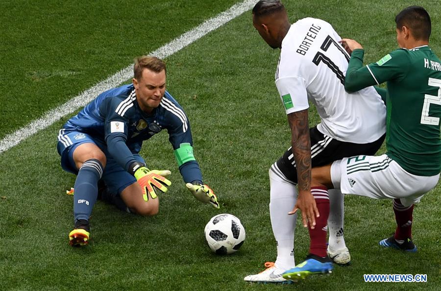 Germany's goalkeeper Manuel Neuer (L) defends during a group F match b...