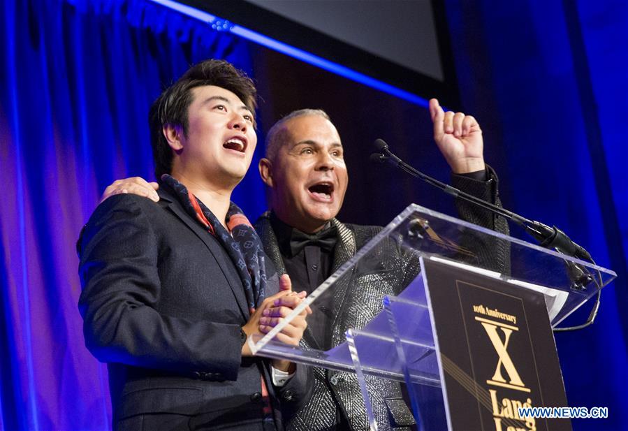 Chinese pianist Lang Lang performs music during the shooting of