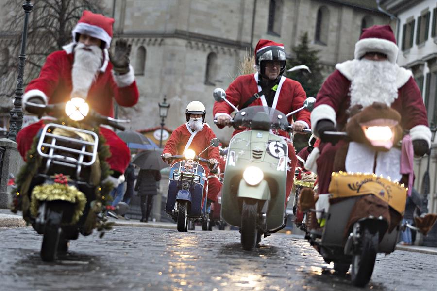 scooter Vespa dress up as Santa Claus for traditional ride in Zurich, Switzerland - | English.news.cn