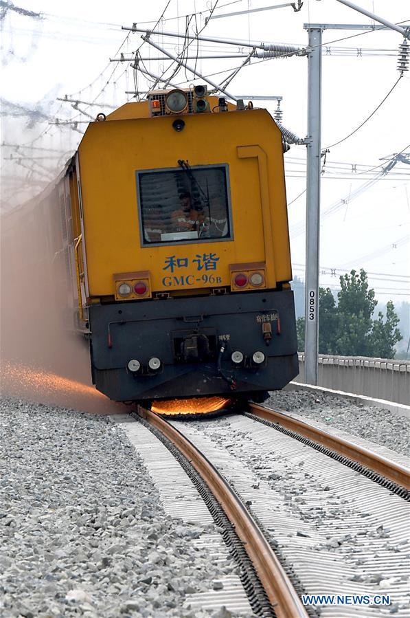 CHINA-HENAN-HEAT-RAIL GRINDING (CN)