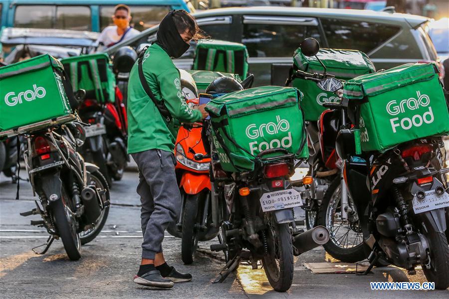 workers-deliver-food-during-labor-day-in-makati-the-philippines