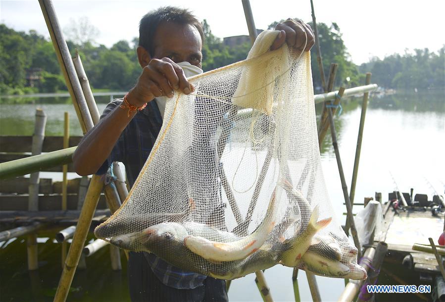 Anglers fish on opening day of fishing season in India Xinhua