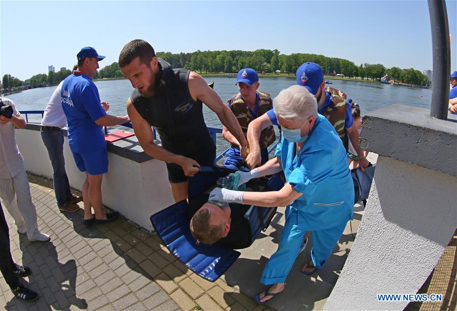 rescue workers participate in water search and rescue drill in