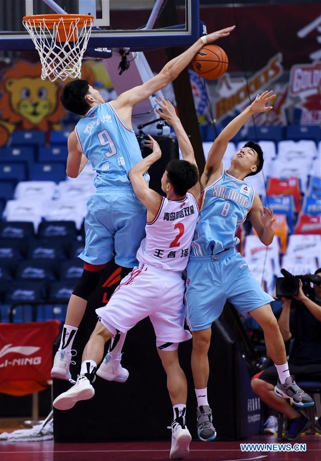 CBA: Xinjiang Flying Tigers vs. Qingdao Eagles - Xinhua