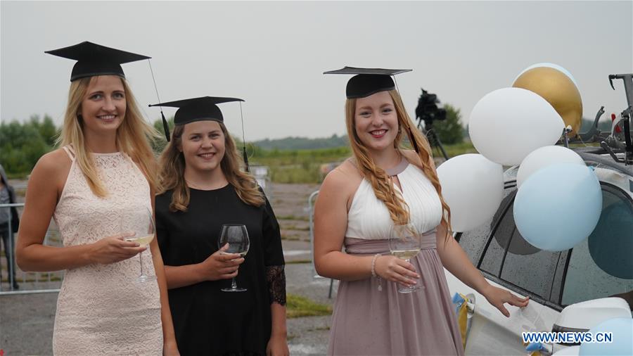 LATVIA-RIGA-DRIVE-IN GRADUATION CEREMONY