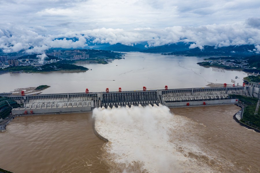 Floodwater gush out from the Jinxi Reservoir in Yongjia county