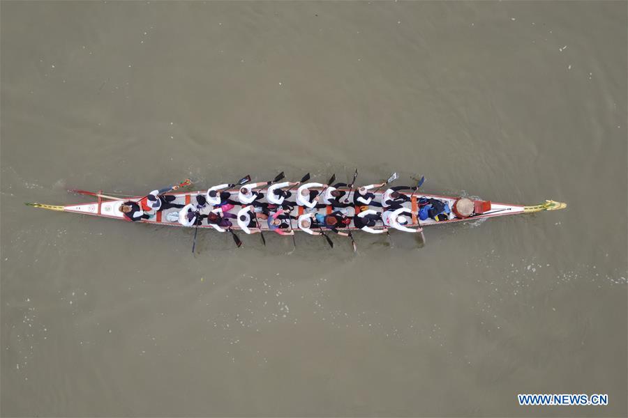 people take part in dragon boat race around szentendre island in