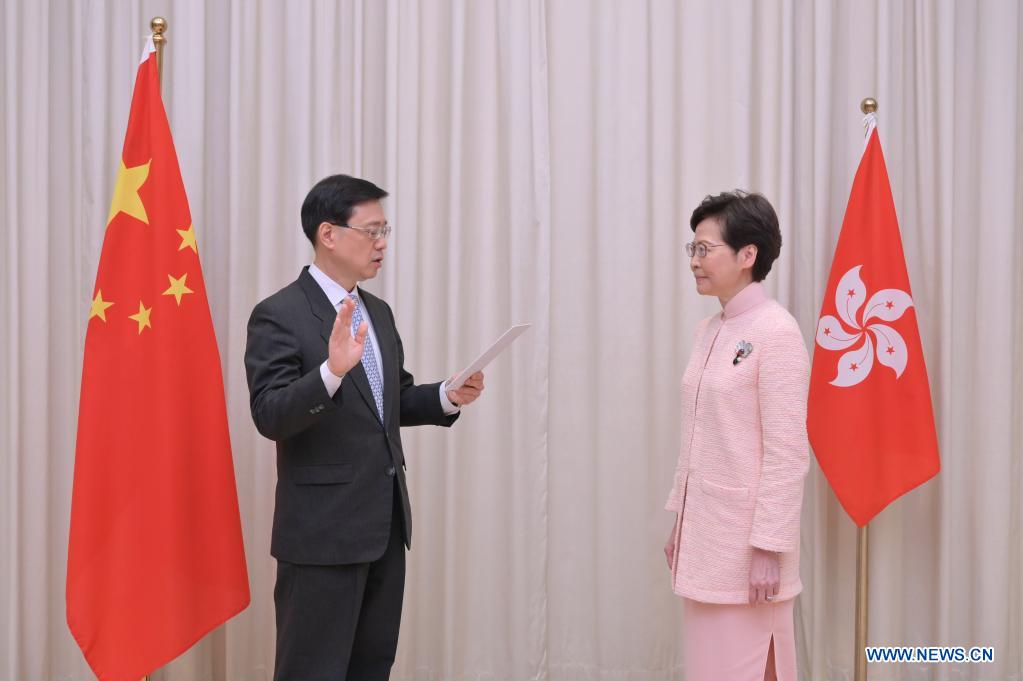 carrie lam, new officials vow to make greater contributions to