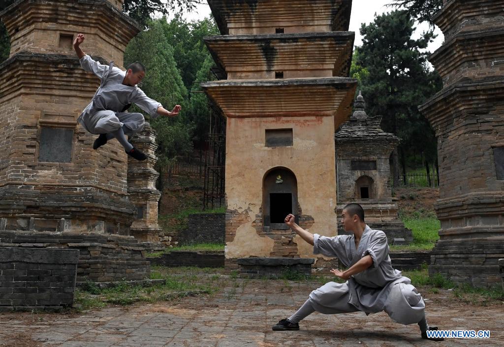 Shaolin Monks Practice Martial Arts At Pagoda Forest Of Shaolin Temple In Henan Xinhua