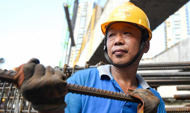Constructors continue their work in hot summer in China's Zhejiang