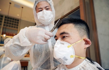 Barbers provide free haircut service for medical workers in Wuhan