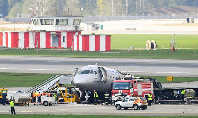 Burnt fuselage of Aeroflot SSJ-100 passenger plane seen on tarmac at Moscow's airport
