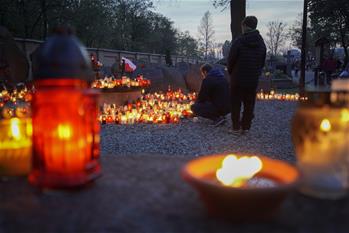 People mourn for deceased on All Saints Day in Poland