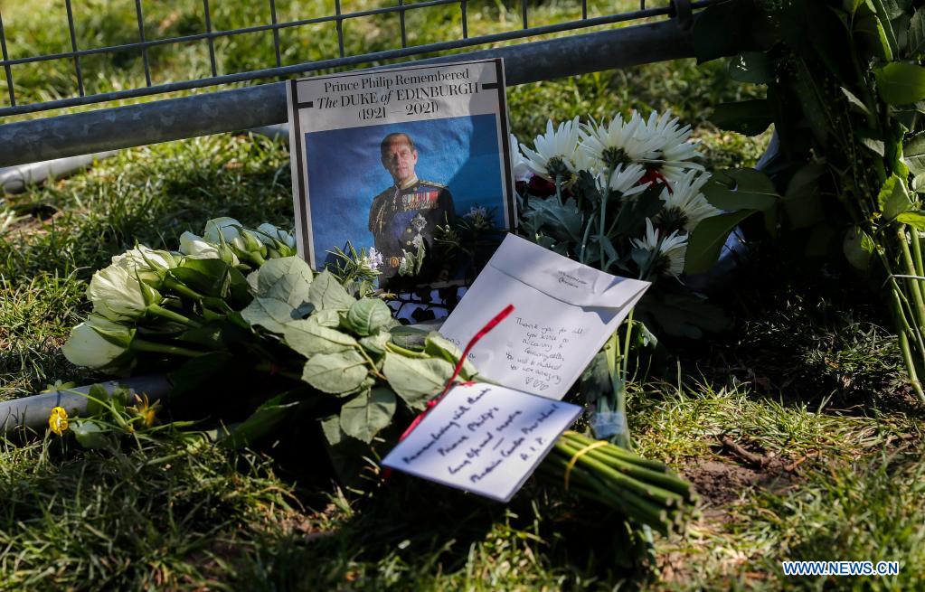 photo taken on april 17, 2021 shows floral tributes placed on