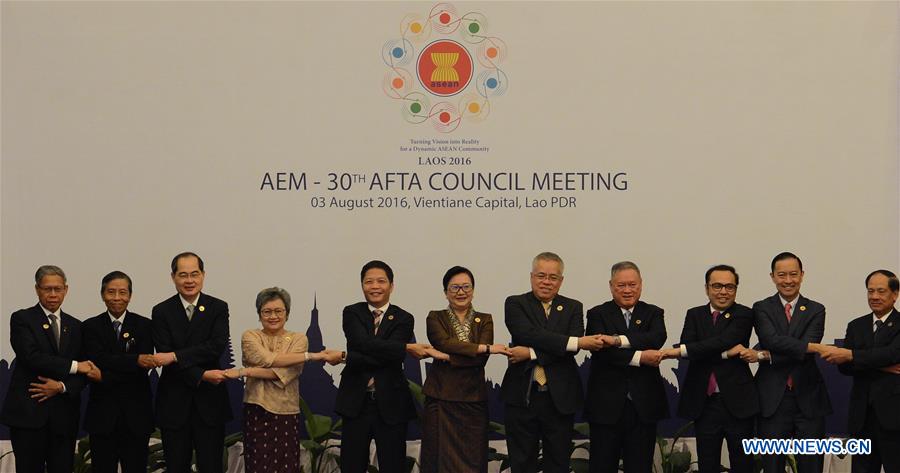 Participants pose for a group photo at the opening of the 30th ASEAN Free Trade Area (AFTA) Council Meeting held during the 48th ASEAN Economic Ministers' Meeting (AEM) and related meetings in Vientiane, Laos, Aug. 3, 2016. 