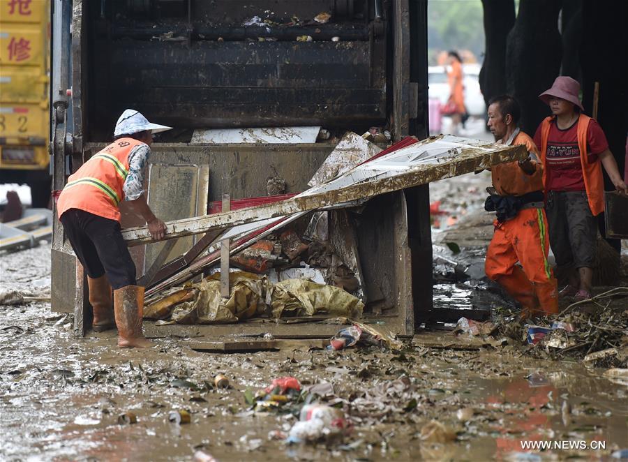 Workers Clear Up Streets After Typhoon Megi Sweeps SE China's Fuzhou ...