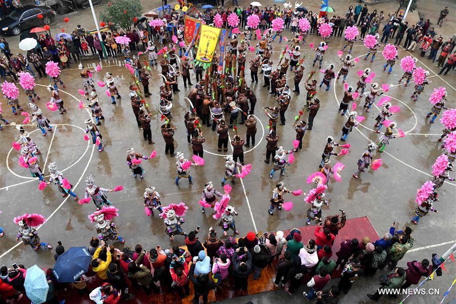 People of Miao ethnic group dance during a gathering to strengthen friendship and to celebrate the Spring Festival, or the Chinese Lunar New Year, at Lindong Village in Rongshui Miao Autonomous County, south China's Guangxi Zhuang Autonomous Region, Feb. 7, 2017