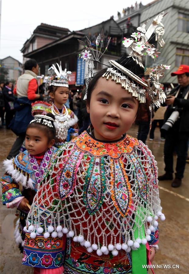 People of Miao ethnic group dance during a gathering to strengthen friendship and to celebrate the Spring Festival, or the Chinese Lunar New Year, at Lindong Village in Rongshui Miao Autonomous County, south China's Guangxi Zhuang Autonomous Region, Feb. 7, 2017