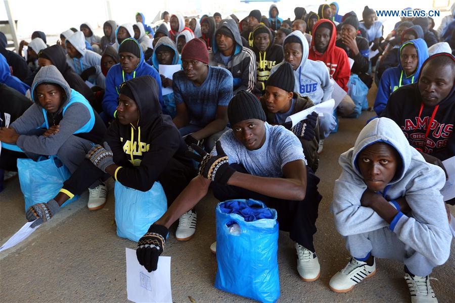 Senegalese immigrants wait before being deported at Mitiga International Airport in Tripoli, capital of Libya, on Feb. 16, 2017.