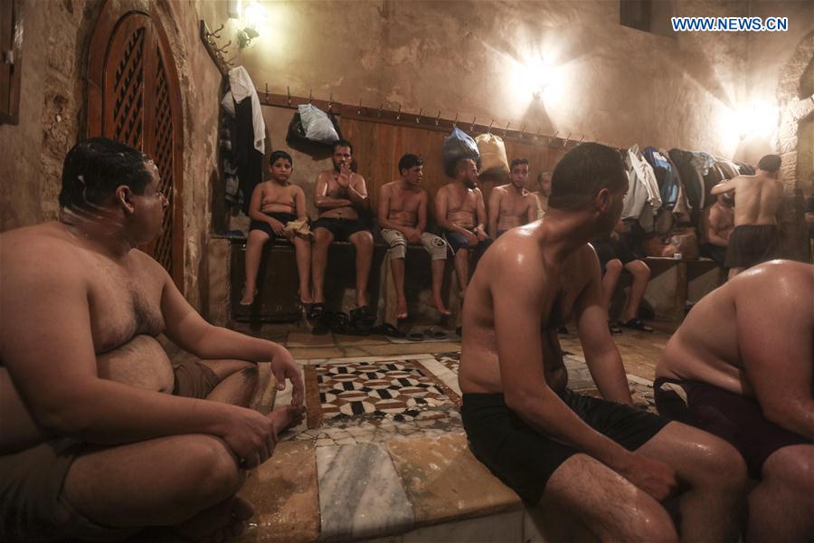 Palestinians relax in Hamam al-Samra, a traditional Turkish steam bath, in ...