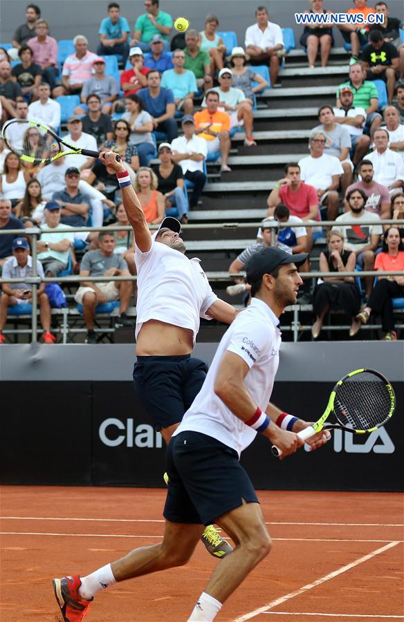 Juan Sebastian Cabal (L) and Robert Farah of Colombia compete during their 1st round doubles match against Thomaz Bellucci and Thiago Monteiro of Brazil at the 2017 ATP Rio Open tennis tournament held at the Brazilian Jockey Club in Rio de Janeiro, Brazil, on Feb. 22, 2017.