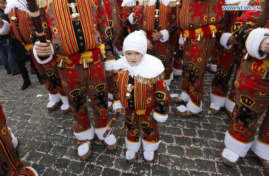 Local residents wearing costumes of 'Gilles' attend the parade of Mardi Gras (Shrove Tuesday), the last day of Carnival in Binche, some 60 km south to Brussels, capital of Belgium, Feb. 28, 2017.