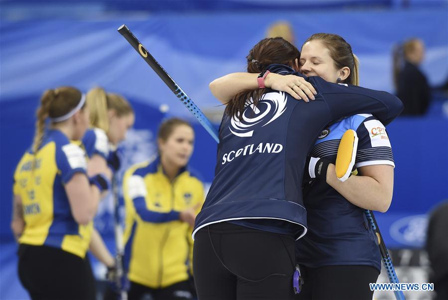 Players of Scotland celebrate victory after the bronze medal match against Sweden at the CPT World Women's Curling Championship 2017, in Beijing, capital of China, March 26, 2017. 