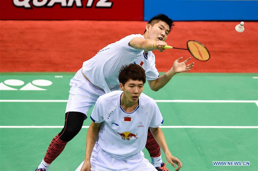 Li Junhui (front) and Liu Yuchen of China compete during the first round of men's double against Liao Kuan Hao and Lu Chia Pin of Chinese Taipei in Yonex Sunrise Indian Open Badminton Championship in New Delhi, India, March 29, 2017. Li Junhui and Liu Yuchen won 2-1. 